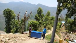 Raz, a young man who had offered us his help in Charikot and Prabhu, our electrician who provides power, carry the medical accessories in the big metal boxes that Florian and Alexandra had bought in Birgunj, to the medical tent. 2